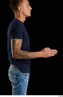 Claudio  1 arm blue t shirt clothing flexing side…